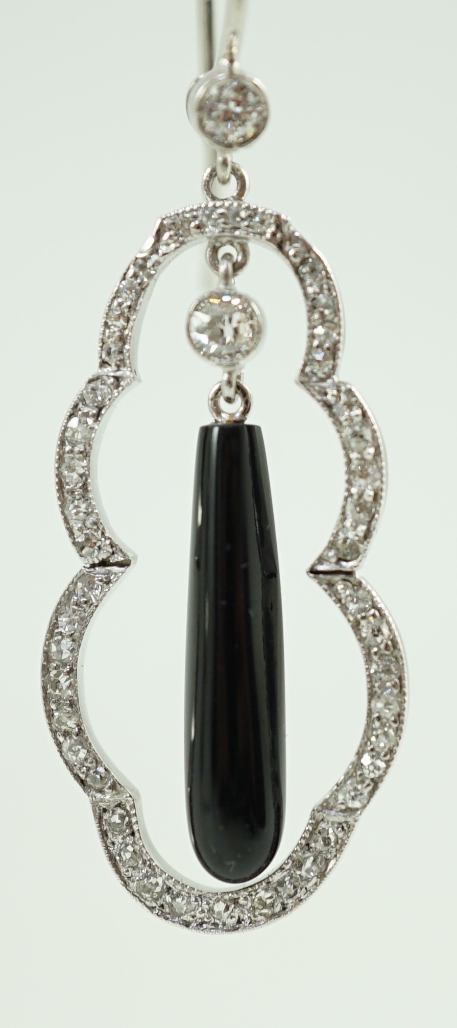 A pair of 20th century white gold, black onyx and diamond cluster set drop earrings